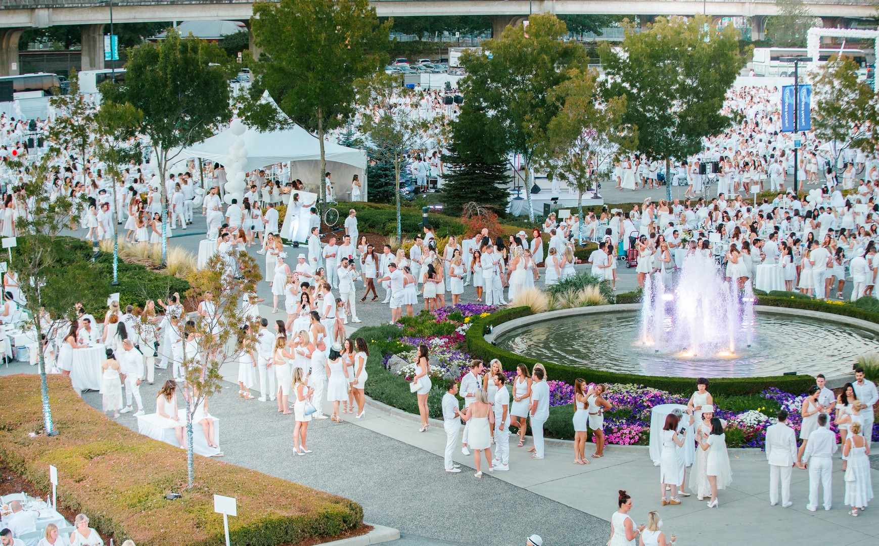Guests of Diner en Blanc Outside the Concord Pacific Vancouver Presentation Centre Water Fountain